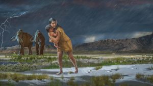 A prehistoric woman holds a child with mammoths in the background