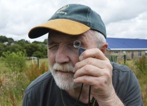 George McGavin and a lens